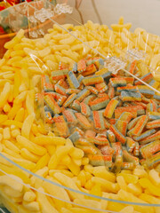 Colorful candy display in a vibrant market setting during a festive occasion