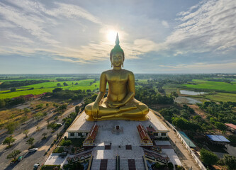 Golden Buddha statue in rural Thailand temple