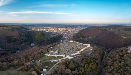 Aerial view ancient fortress from 8th century on top of a hill and city Shumen, Bulgaria
