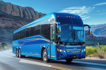 A large blue passenger bus driving on a scenic desert road