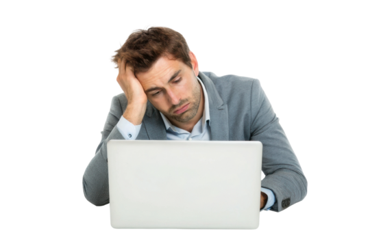 Man feeling frustrated while working on laptop in office setting