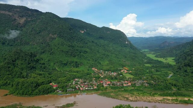 The village of Muang Ngoi Neua between Nam Ou and the green mountains in Asia, Laos, near Luang Prabang, in summer, on a sunny day.&nbsp;