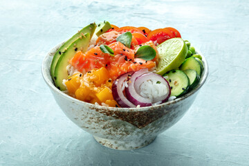Poke bowl with salmon. Hawaiian salad with rice, fish, tomato, and avocado. Healthy diet