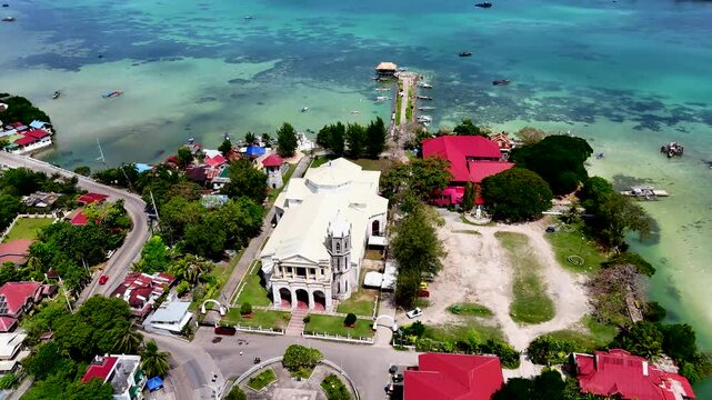 Dauis Church of Our Lady of the Assumption in Panglao, Bohol island. Aerial 4K drone video footage of Philippines