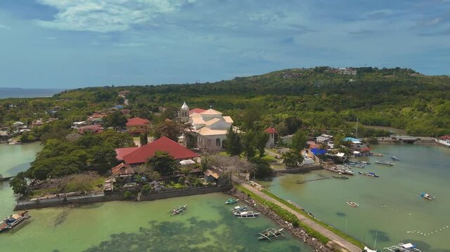 Dauis Church of Our Lady of the Assumption in Panglao, Bohol island. Aerial 4K drone video footage of Philippines