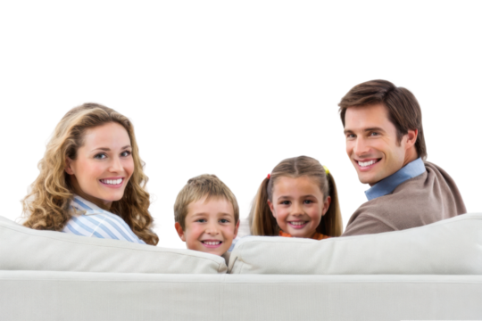 Happy family together on couch enjoying quality time with children smiling and experiencing joy in home environment