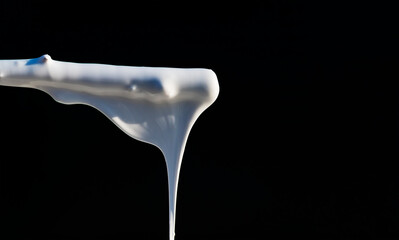 Dripping paint on a dark background