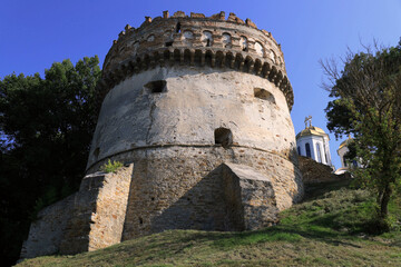 Photo with a view of the Round Tower of the Ostroh Castle in the city of Ostroh, Rivne region, Ukraine