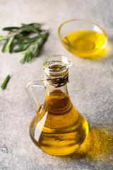 Organic olive oil in a jug on vintage background	