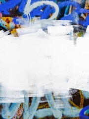 Urban graffiti art with white spray paint, bold vibrant colors. 90s, street style, gritty texture,...