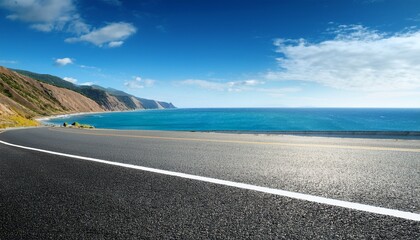 Fototapeta premium Asphalt road and beautiful coastline nature landscape under blue sky