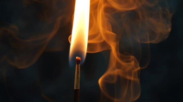 Burning matchstick producing smoke in the dark