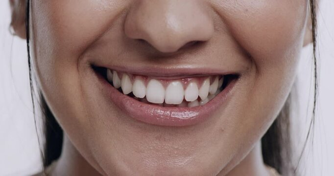 Woman, lips and biting for flirting in studio for romantic gesture for dating, love or mockup space. Female person, mouth and teeth or white background or playful smile expression, emoji or tease