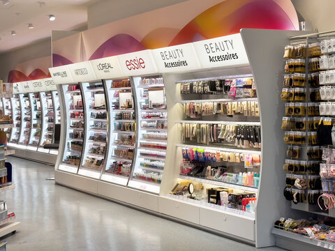 Cosmetics display in retail store featuring makeup and beauty accessories