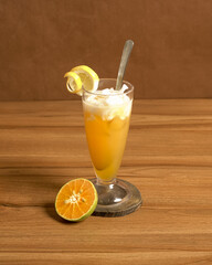 Iced Coconut Orange Drink A Refreshing Blend of Young Coconut and Orange Juice Served Cold in a Glass with a Fresh Orange Garnish.