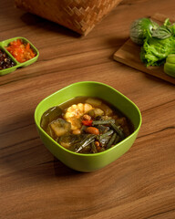 Traditional Sayur Asem Served with Fresh Vegetables and Spicy Sambal, A Classic Indonesian Sour Vegetable Soup with Bold Flavors and Refreshing Taste.