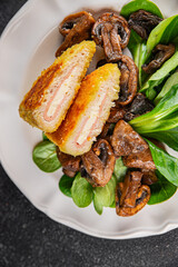 Cordon Bleu Cutlet meat chicken, ham, cheese appetizer dish fresh delicious gourmet food background on the table rustic food top view copy space