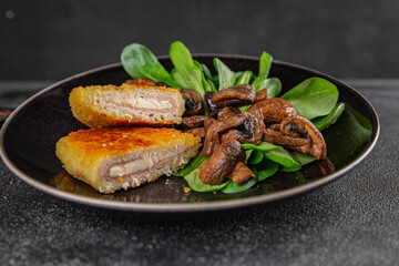 Cordon Bleu Cutlet meat chicken, ham, cheese appetizer dish fresh delicious gourmet food background on the table rustic food top view copy space
