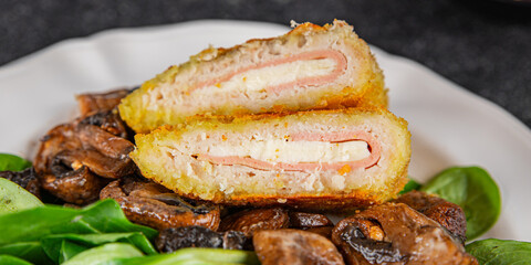 Cordon Bleu Cutlet meat chicken, ham, cheese appetizer dish fresh delicious gourmet food background on the table rustic food top view copy space