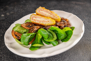 Cordon Bleu Cutlet meat chicken, ham, cheese appetizer dish fresh delicious gourmet food background on the table rustic food top view copy space