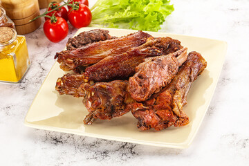 Roasted duck wings with sauce