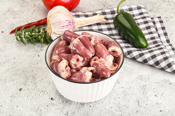 Fresh raw chicken hearts in the bowl