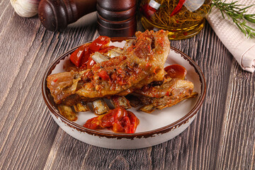 Baked lamb ribs with vegetables