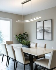 A dining room with a linear statement light fixture hanging above a sleek table