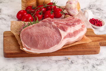 Raw potk loin steak with bone
