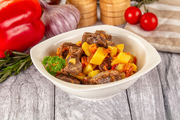 Rogiut with meat, potato and tomatoes