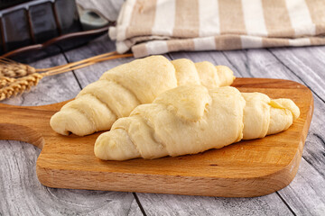 Raw uncooked croissant for bake