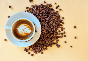 coffee beans and a cup of coffee with space for text