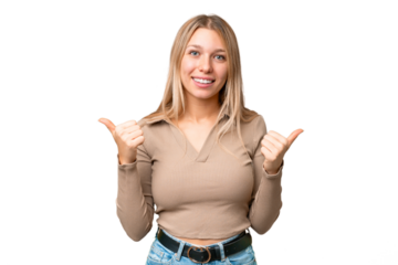 Young pretty blonde woman over isolated chroma key background with thumbs up gesture and smiling