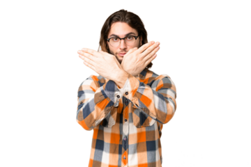 Young handsome man over isolated chroma key background making stop gesture with her hand to stop an act
