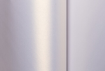 Background with satin paper texture. Glossy folded surface with pearlescent gradient in lavender,...