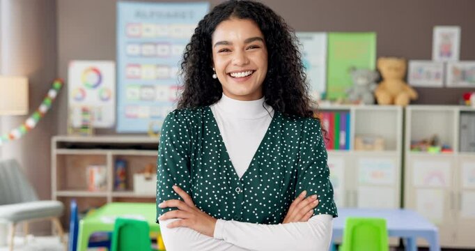 Happy woman, face and kindergarten teacher with confidence in classroom for childhood development. Portrait female person or educator with smile or arms crossed for youth, growth or elementary school