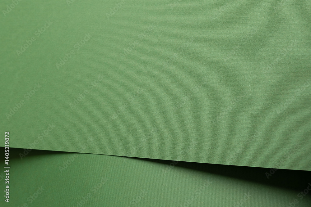 Aufkleber paper background with matte texture. folded layered sheets in pastel green, sage green, and subtle g