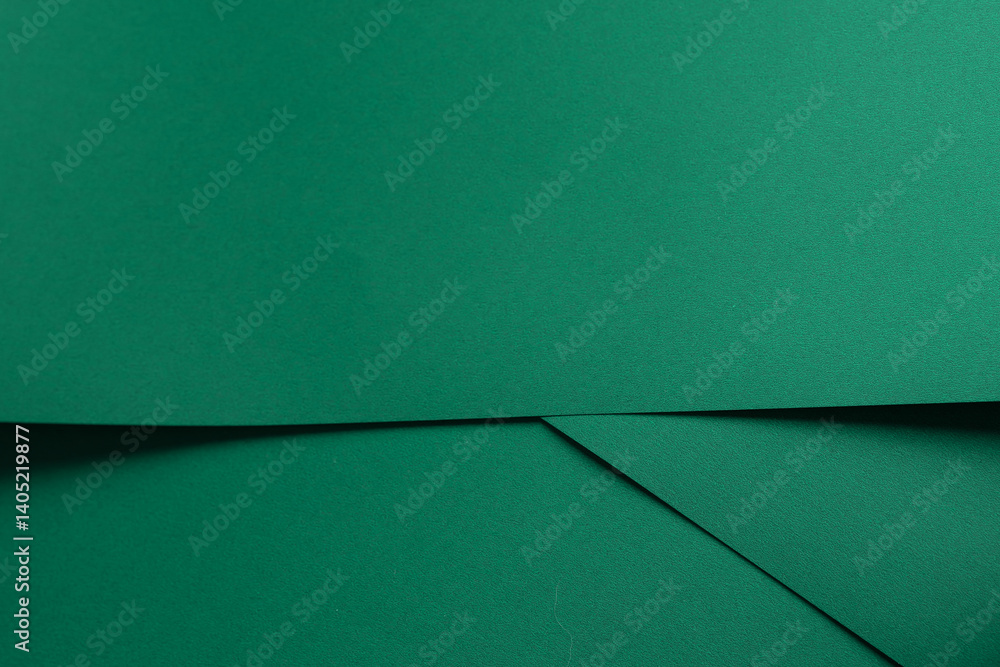 Poster paper background with matte texture. folded layered sheets in emerald green, jade green, and fresh g