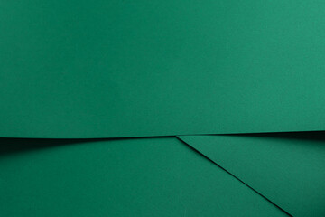 Paper background with matte texture. Folded layered sheets in emerald green, jade green, and fresh...