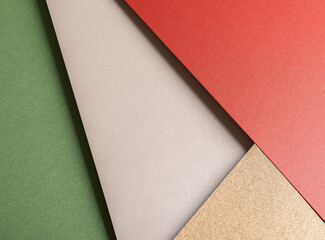 Paper background with matte texture. Layered diagonal sheets in crimson red, champagne, soft beige,...