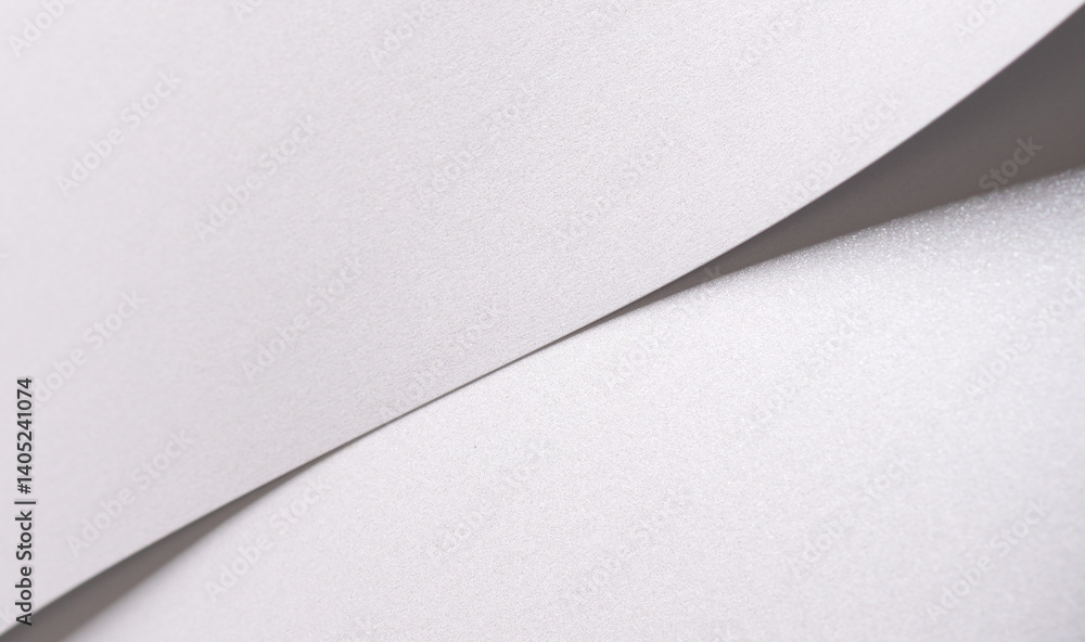 Aufkleber white satin paper background with a pearlescent, glossy texture and layered, folded curves. pale sil