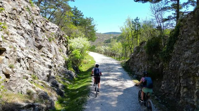 Aerial view of the Giordano Cottur cycle and pedestrian path near Trieste, Italy, winding through the stunning Val Rosandra Nature Reserve. This scenic trail follows a dramatic canyon, panorama