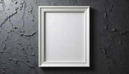 An antique white frame, a blank canvas waiting for a cherished memory against a textured dark gray wall, ready to hold a loved one's photograph.