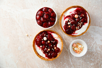 Cream cheese tarts with cherries