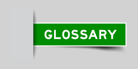 Green color square shape sticker label with word glossary inserted in gray background