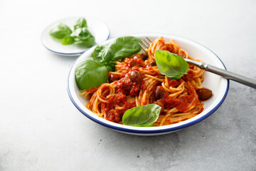 Pasta Puttanesca with olives and tomatoes