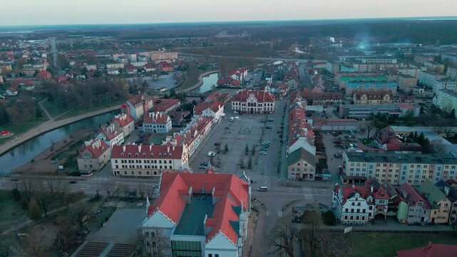 Aerial view of Pisz Poland showing town hall, riverside buildings and surrounding neighborhoods