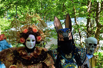Two mysterious characters in luxurious fancy dress