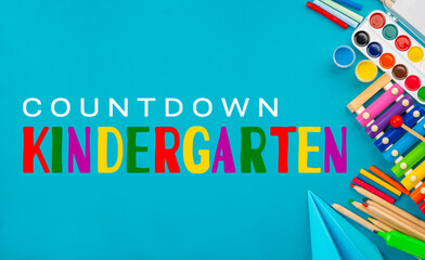 Countdown kindergarten background. Top view flat lay concept. Childish lettering, colored paper, supplies, stationery for Pre-school, nursery school, kindergarten or preschool educational