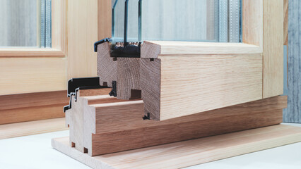A window frame is displayed with a wooden frame and a glass frame. The wooden frame is made of wood...